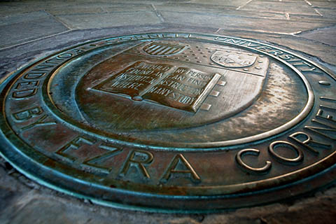 The bronze university seal embedded in the floor of Myron Taylor Hall.