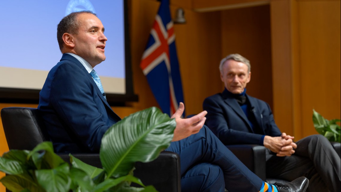 Iceland President Guðni Th. Jóhannesson sits on stage with moderator Peter Katzenstein