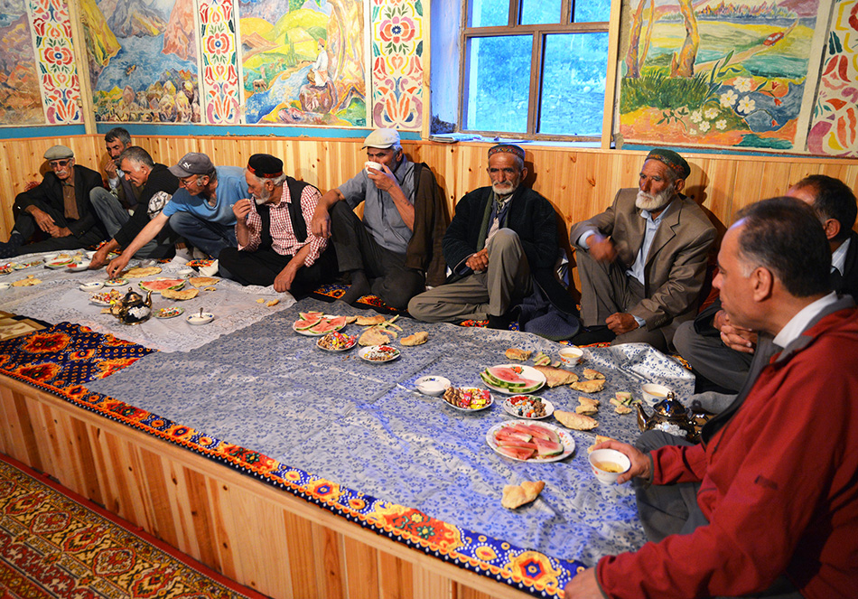 Research team meal with villagers in Savnob