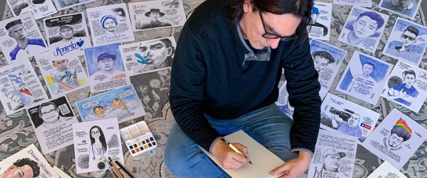 Molina sitting on the floor and sketching, surrounded by his illustrations.