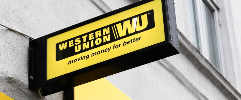 Western Union sign and logo on a facade.