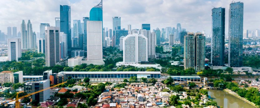Panoramic view of Jakarta with residential houses, modern office and apartment buildings.