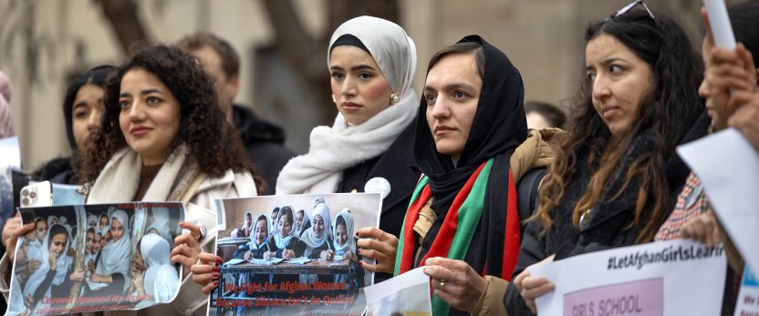 Students rally to raise awareness of the plight of Afghan girls and women living under the Taliban outside Day Hall.