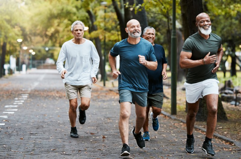 Aged runners in park