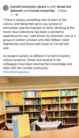 Facebook post with image a masked woman sitting at a library reference desk.