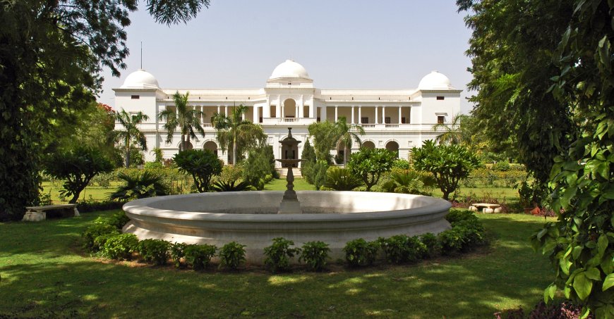 The Pataudi Palace with landscaping around the white ornate building