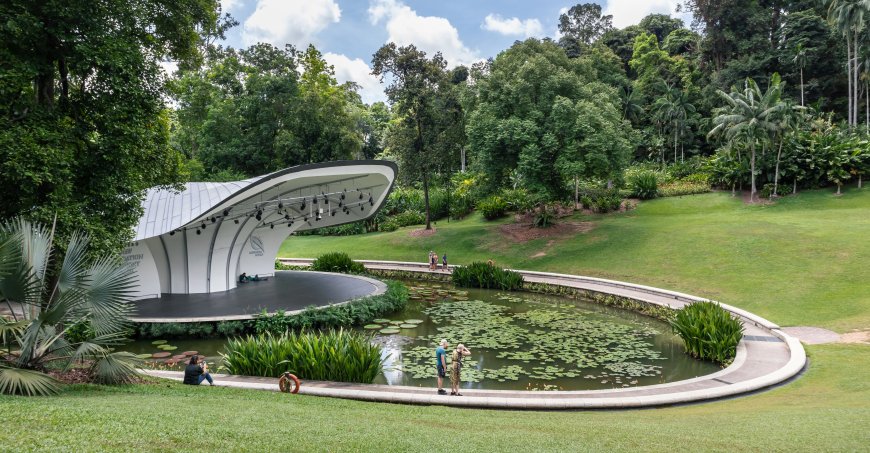 A concert stage in the Singapore Botanic Gardens with a pond surrounding the stage