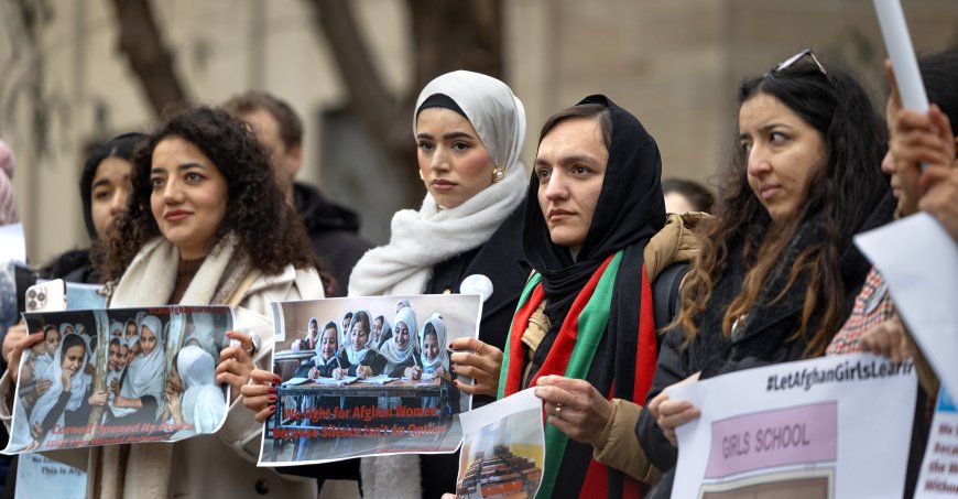 Students rally to raise awareness of the plight of Afghan girls and women living under the Taliban outside Day Hall.