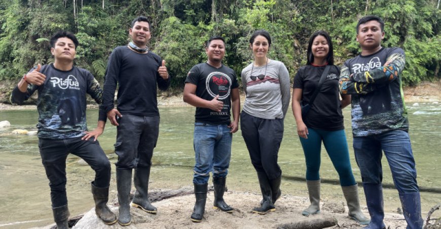  Six people standing on the water's edge. Indigenous conservation leaders continue monthly monitoring efforts.