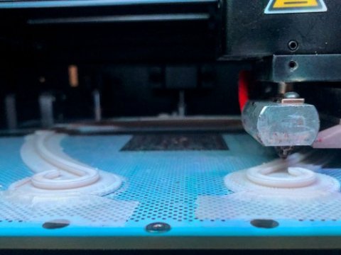 Closeup view of protective visor on a 3D printer