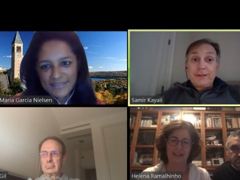 grid of faces on a group call from a computer screen