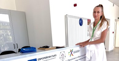 Svitlana Turlakova standing near a desk.