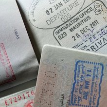 Open passports with stamps from different countries. 