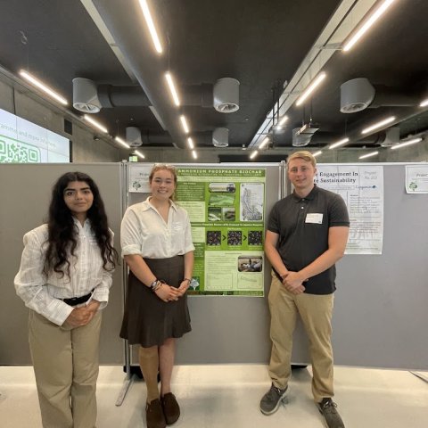 A team of Cornell students at the DTU Green Challenge pose for a photo with their research poster.