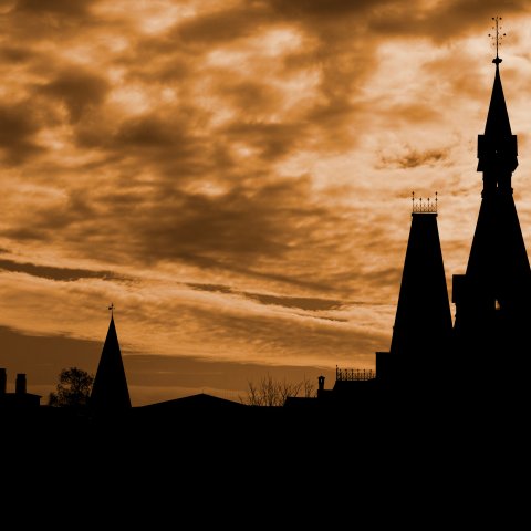 Sage Hall at sunset, with clouds